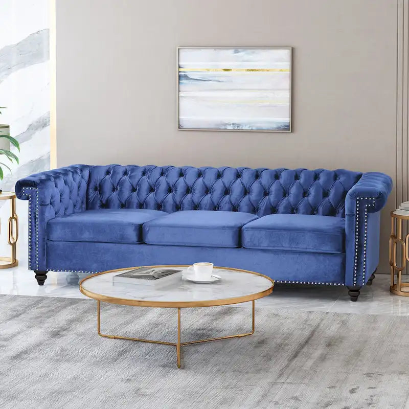 Canapé en velours capitonné avec clous décoratifs